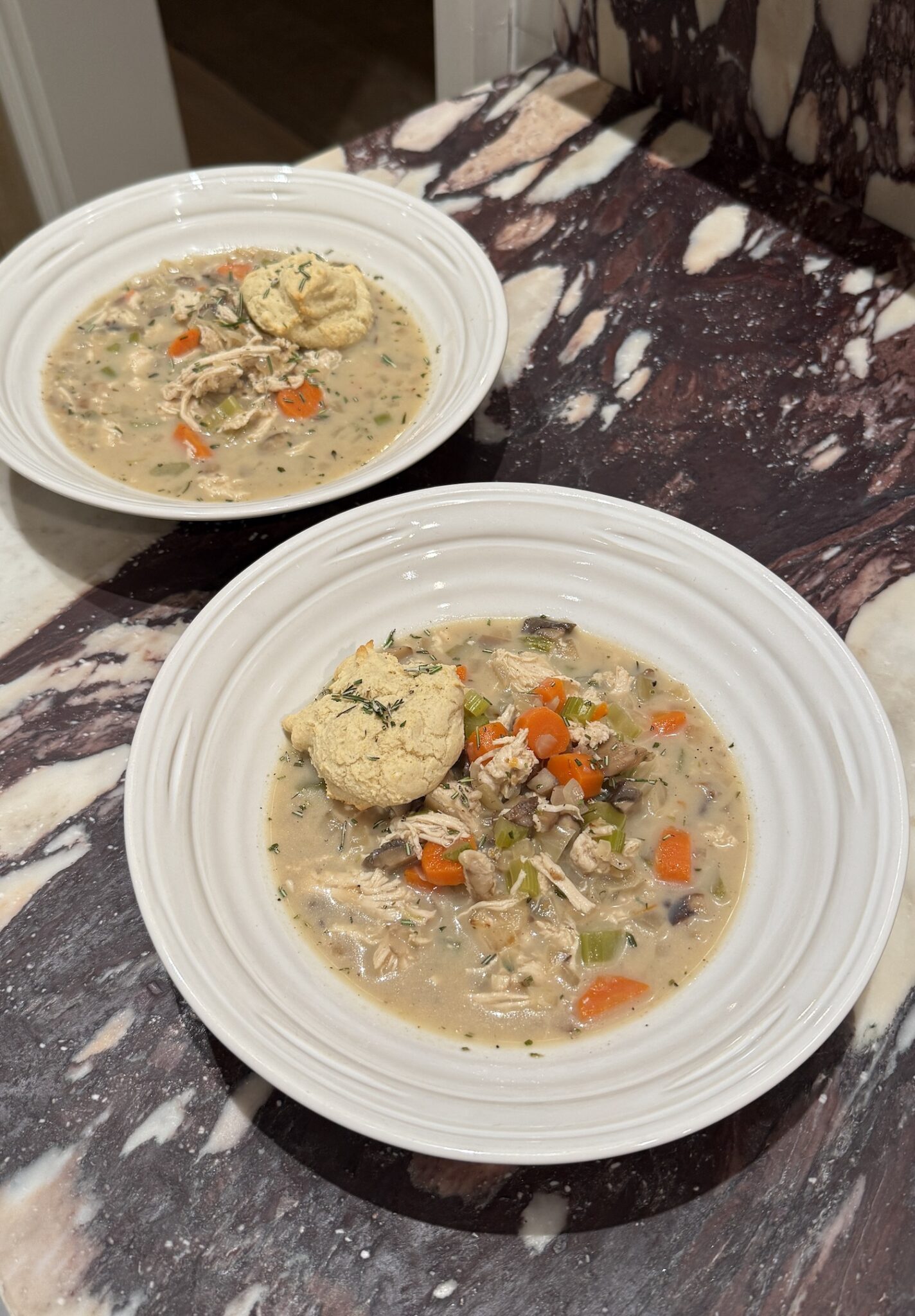 Creamy, cozy, and full of flavor — this lightened-up Chicken Pot Pie Soup skips the crust and adds fluffy 15-minute drop biscuits instead! A gluten-free, high-protein fall dinner everyone will love.