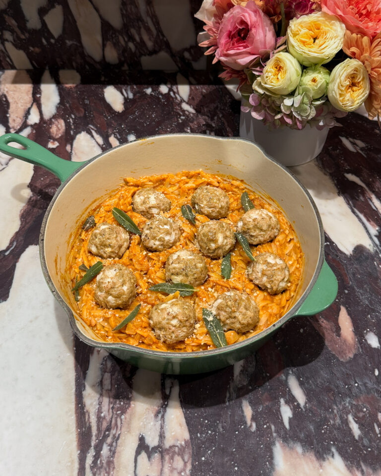 Juicy baked sage chicken meatballs served over creamy pumpkin orzo — the coziest fall dinner you’ll crave all season. Packed with protein, full of flavor, and ready in under 40 minutes!